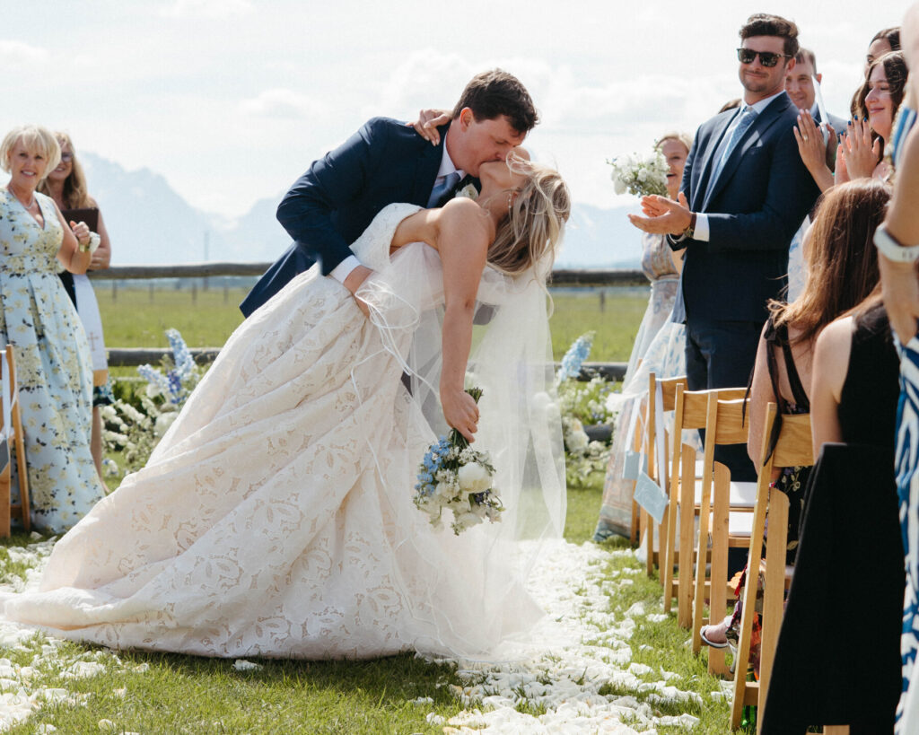 bride-groom-ceremony-kiss-diamond-cross-ranch-wy