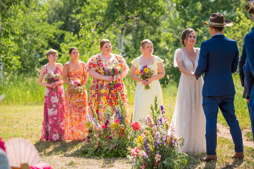Mountain-inspired wedding florals at the altar with natural textures