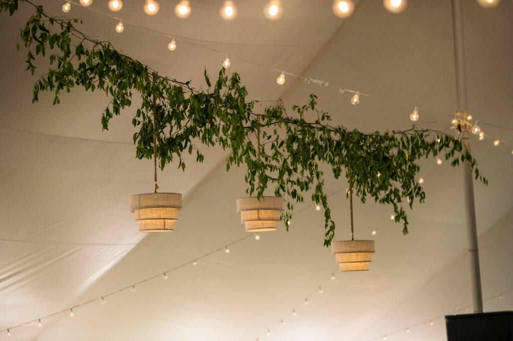 Lush greenery installation over dance floor at Wyoming wedding