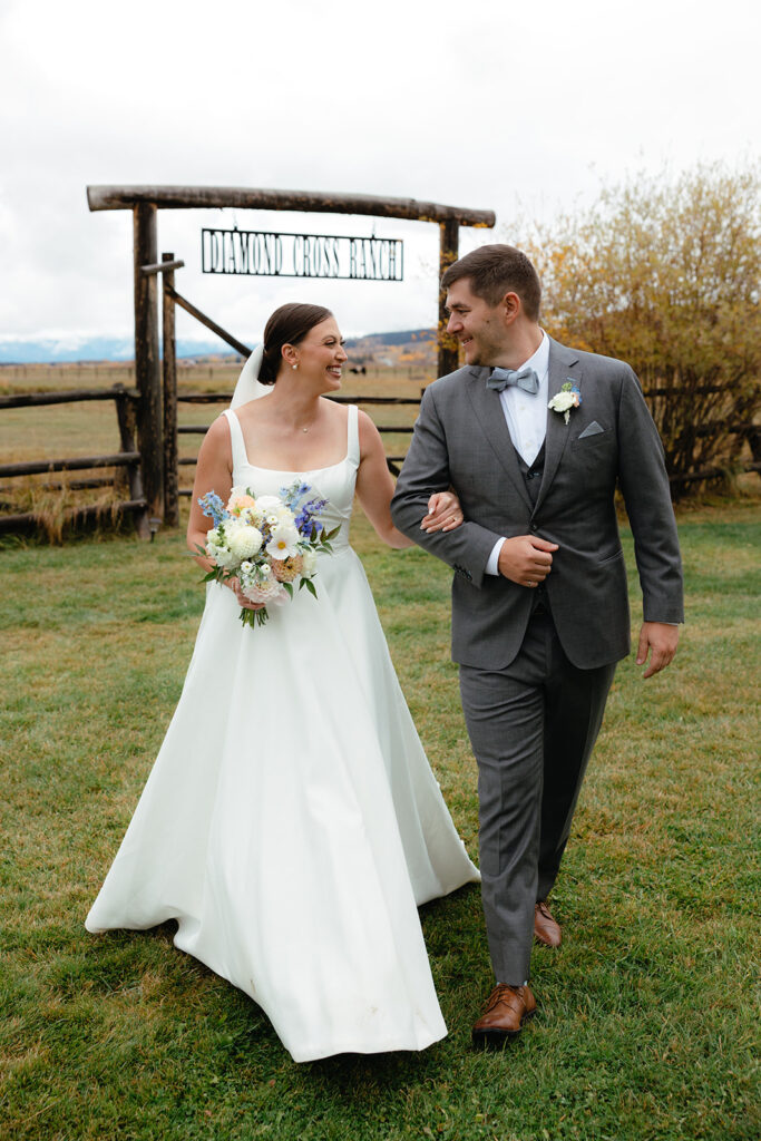 Bride and groom with locally-grown bridal bouquet at wyoming ranch wedding
